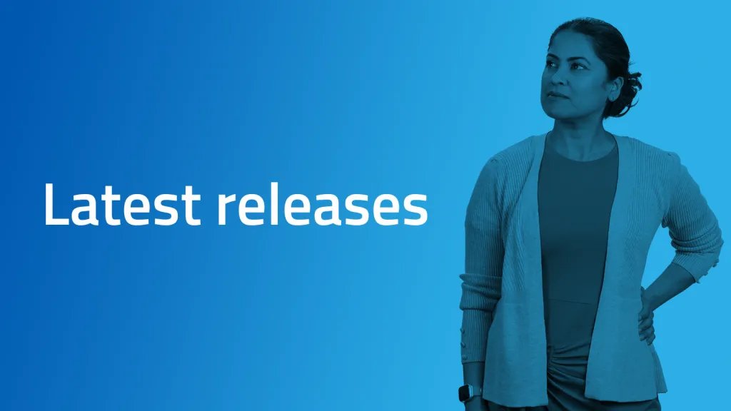 A teacher is standing next to text that says "Latest releases"